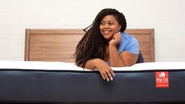 A woman rests on a Big Fig mattress.