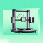 An Anker 3D printer against a green background.