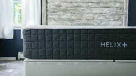 A bed with a Helix Plus mattress